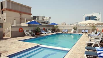 Outdoor pool, open 9:00 AM to 8:00 PM, pool umbrellas, pool loungers