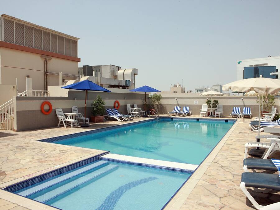 Outdoor pool, open 10:00 AM to 8:00 PM, pool umbrellas, pool loungers