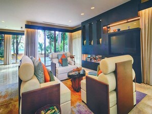 Spa Villa | Living area | 55-inch flat-screen TV with satellite channels, TV, DVD player