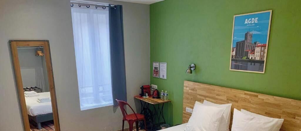 Premium bedding, desk, laptop workspace, blackout drapes