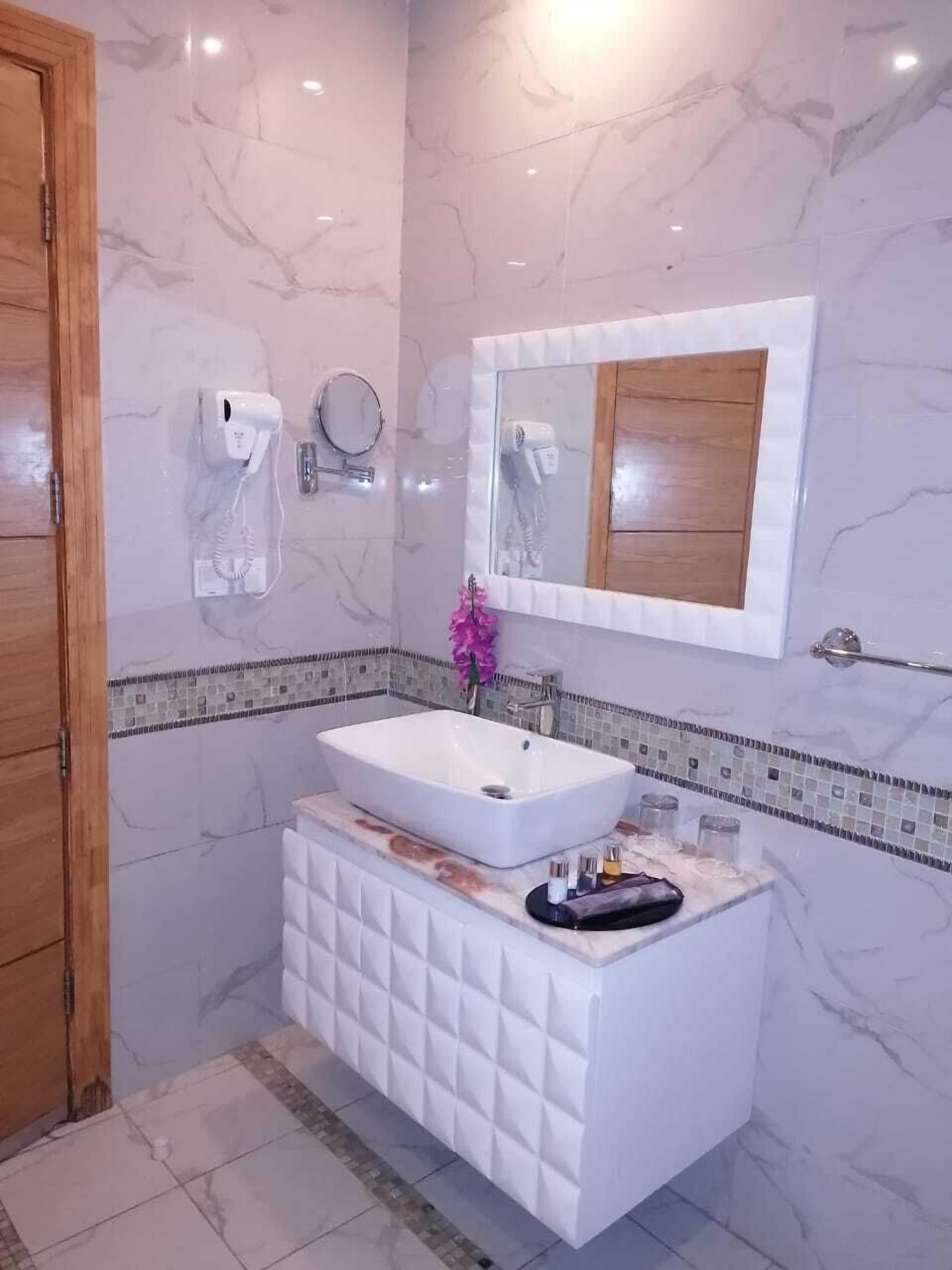 shower, slippers, bidet, towels