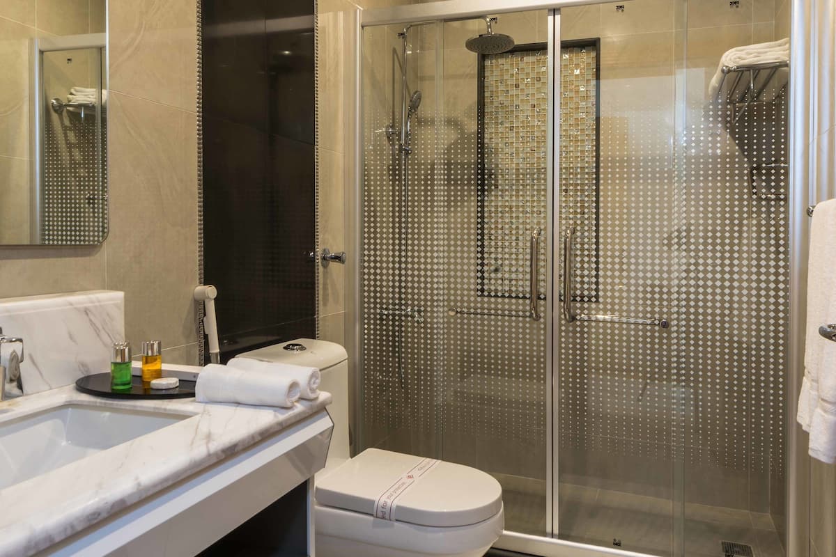 shower, slippers, bidet, towels