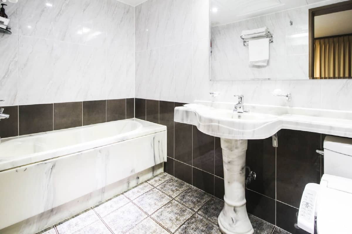 family suite | bathroom | free toiletries, hair dryer, bathrobes, slippers