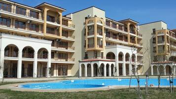 Seasonal outdoor pool, pool umbrellas, pool loungers