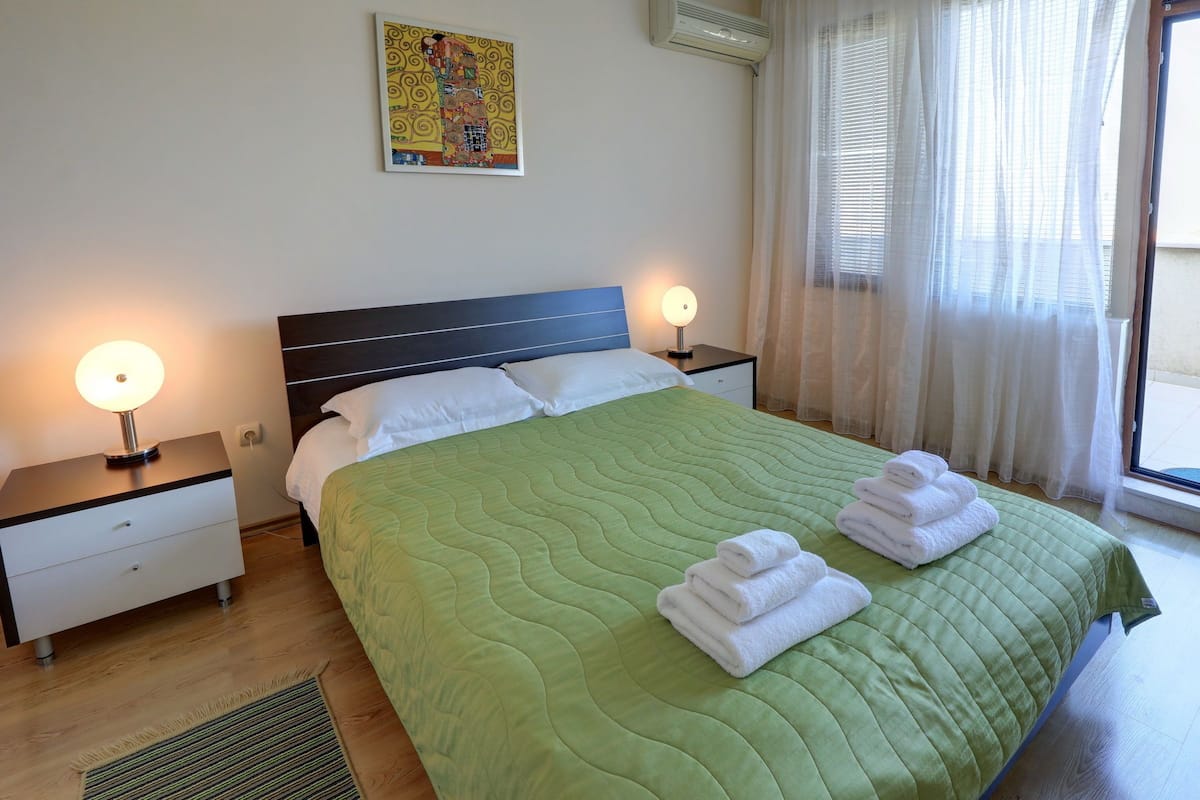 Deluxe Apartment, 2 Bedrooms, Balcony, Partial Sea View | Desk, iron/ironing board, cribs (free), rollaway beds (surcharge)
