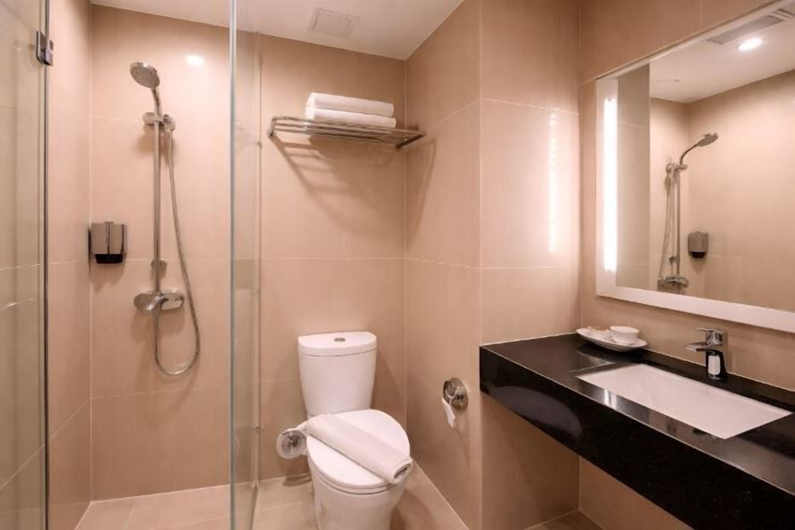 Shower, hair dryer, slippers, towels