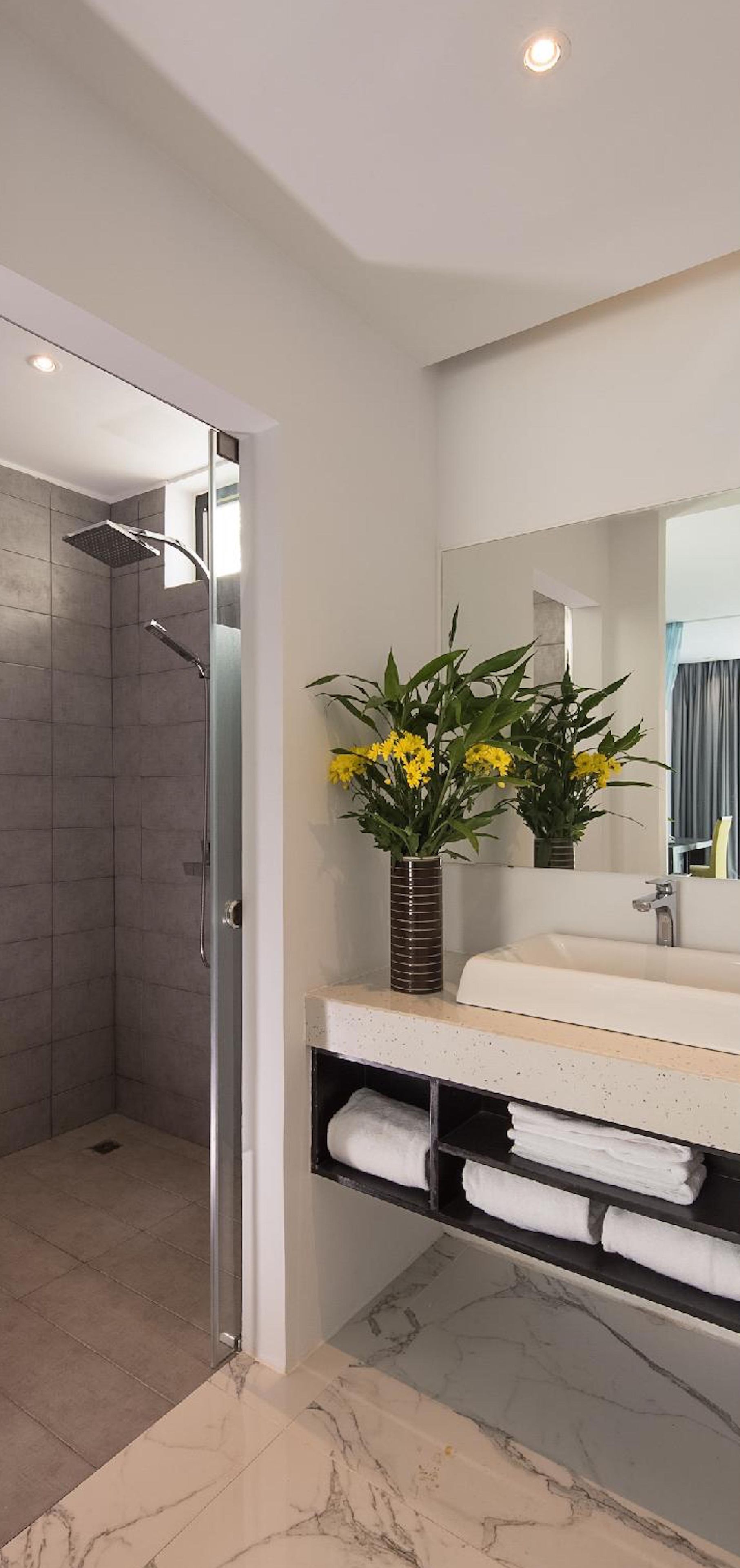luxury deluxe king | bathroom | designer toiletries, hair dryer, bathrobes, slippers