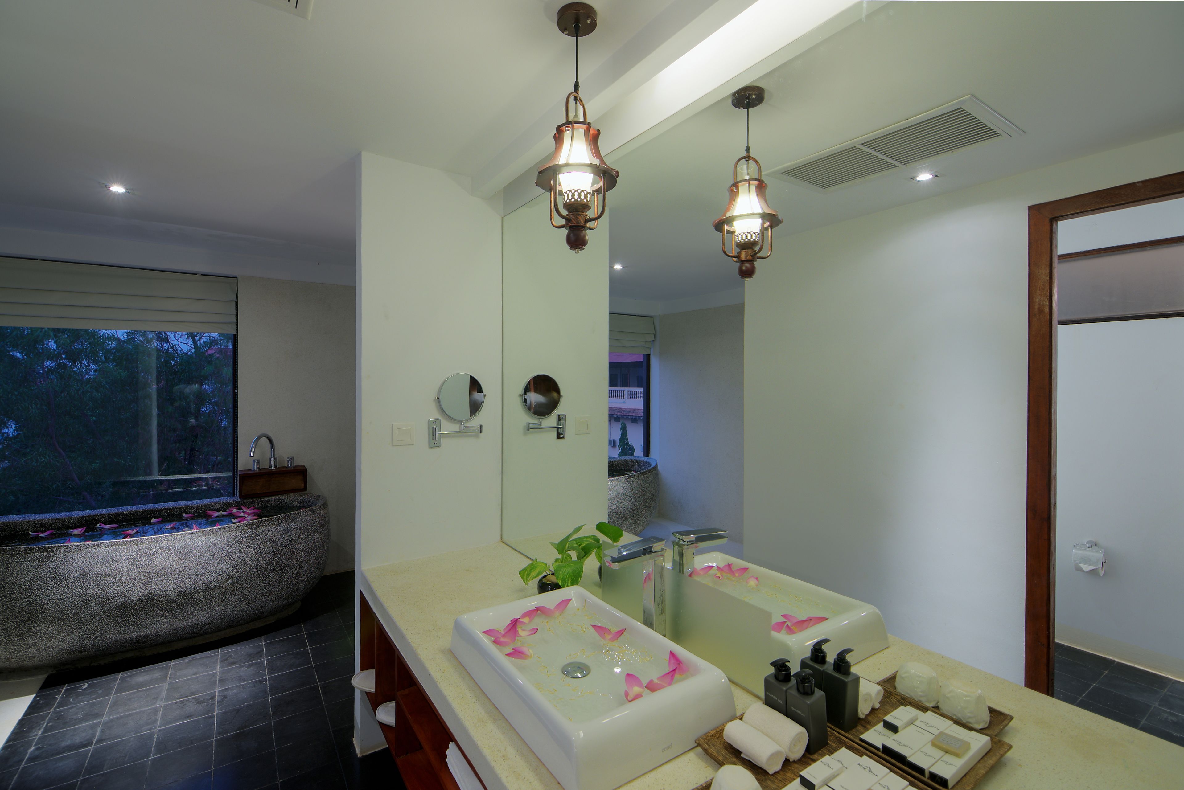 luxury honeymoon suite | bathroom | designer toiletries, hair dryer, bathrobes, slippers