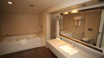 Deluxe Room | Bathroom | Hair dryer, slippers, towels, soap