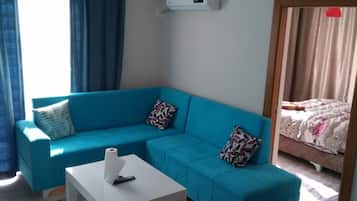 Apartment, 1 Bedroom | Living area | LCD TV