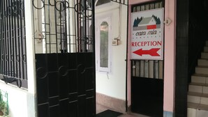 A reception area with a sign indicating 'RECEPTION' and a direction to 'casa mia'. - Casa Mia (Guwahati)
