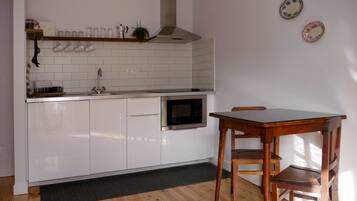Apartment, 1 Bedroom (2 Adults) | Private kitchenette | Fridge, microwave, stovetop, high chair