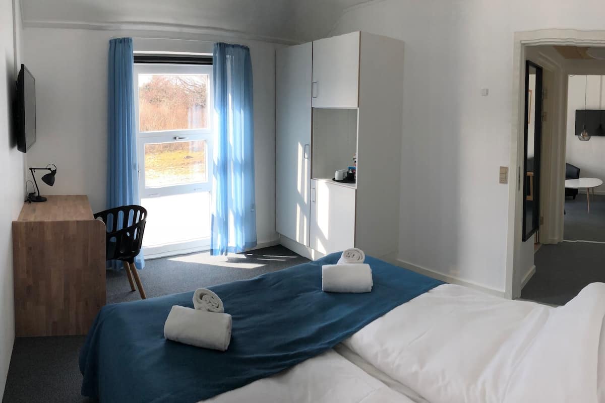 Desk, blackout curtains, free WiFi, bed sheets