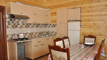 Villa | Private kitchenette | Full-sized fridge, stovetop, electric kettle, cookware/dishes/utensils