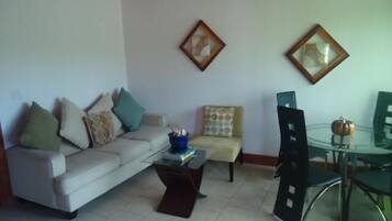 Standard Apartment, 1 Queen Bed | Living room | Flat-screen TV, pay movies