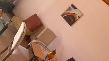 Standard Apartment, 1 Queen Bed | Living area | Flat-screen TV, pay films