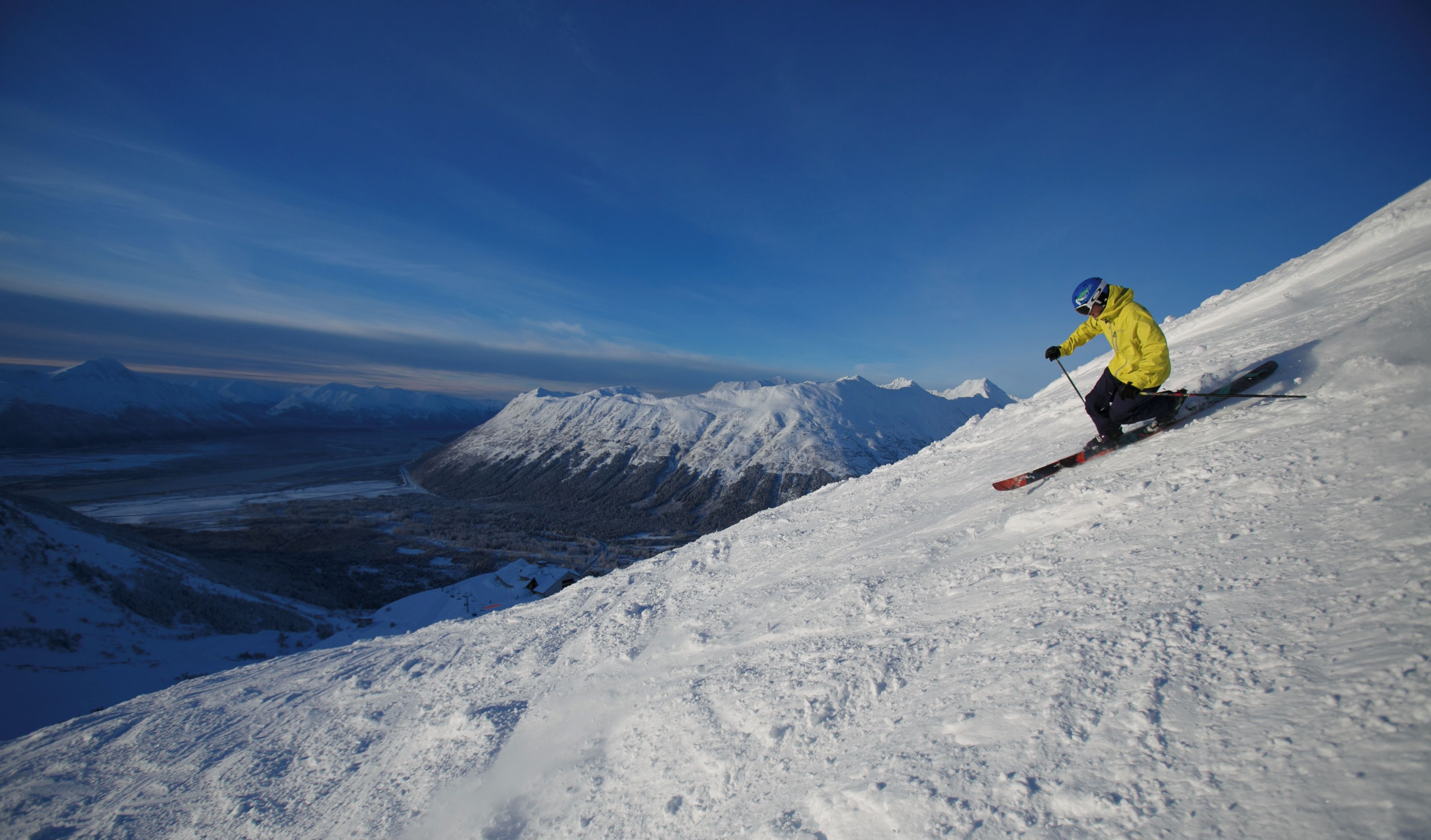 A skier on a snowy slope at Alyeska Resort.