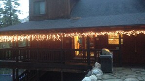 A wooden building with a stone staircase leading up to a porch. - Beautiful Donner Lake Home  (Truckee)