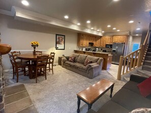 Smart TV, fireplace, books, computer monitors