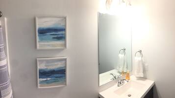 Combined shower/tub, towels, soap, shampoo