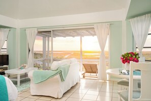 Panoramic Cottage, 1 Queen Bed, Ocean View, Beachside | Living area | Flat-screen TV - Dragon Cay Resort (Conch Bar)