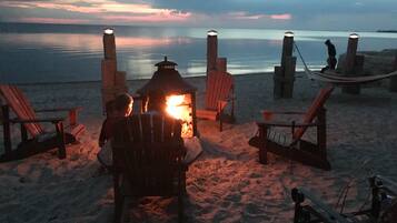 On the beach, sun-loungers, beach towels