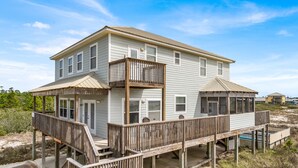 A two-story house with a balcony and a deck. - Large 6 Bdrm home with amazing Gulf Views, Easy Beach Access, and Private Pool (Gulf Shores)