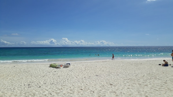 On the beach, sun-loungers, beach towels
