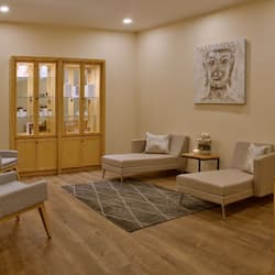 Relax in this inviting living area with a sofa, chair, and side table.