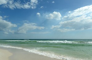 A beach with clear skies and waves. - The Palms, hot tub, pool (Panama City Beach)