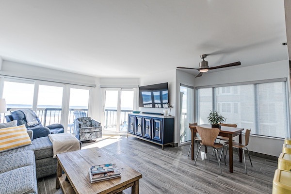 Living Room with 180 degree view of beach/ocean. 65" Ultra HD smart TV.