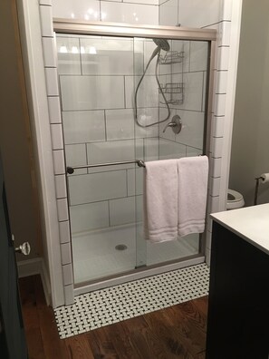 Shower, hair dryer, towels, soap