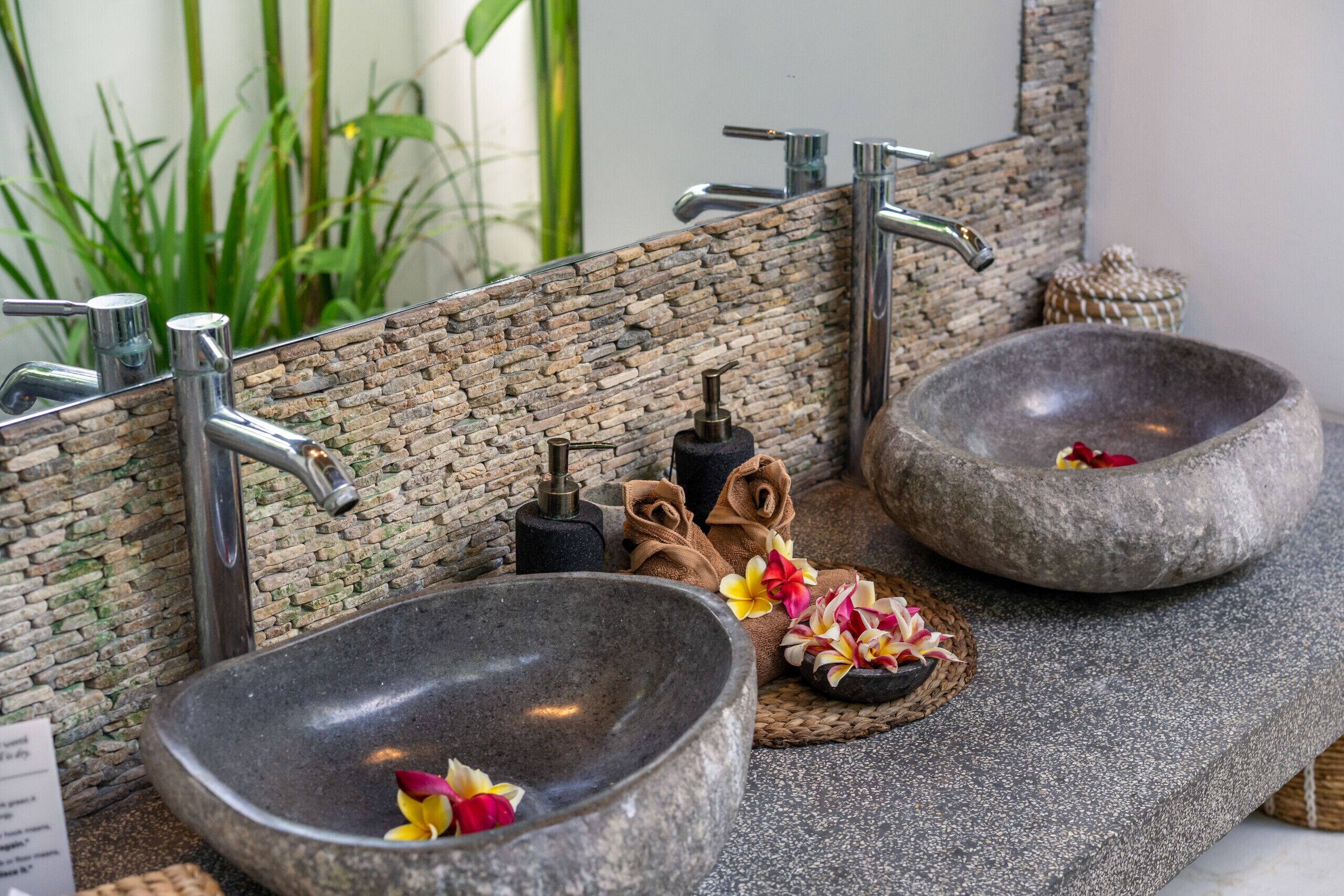 A stone sink with a stone basin and a stone countertop.