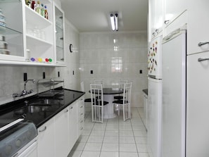 Full-sized fridge, microwave, stovetop, cookware/dishes/utensils