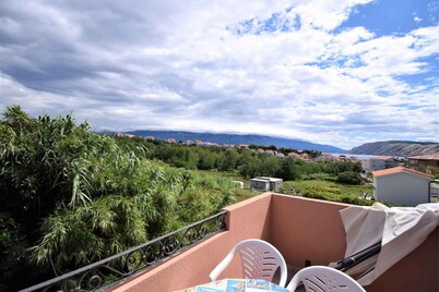 Holiday apartment with balcony and air conditioning