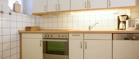 Fridge, oven, dishwasher, dining tables