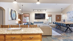 A spacious kitchen with a large island, wooden cabinets, and pendant lighting. - Private Pool - Pickleball - Hot Tub - Theatre Room (Branson)