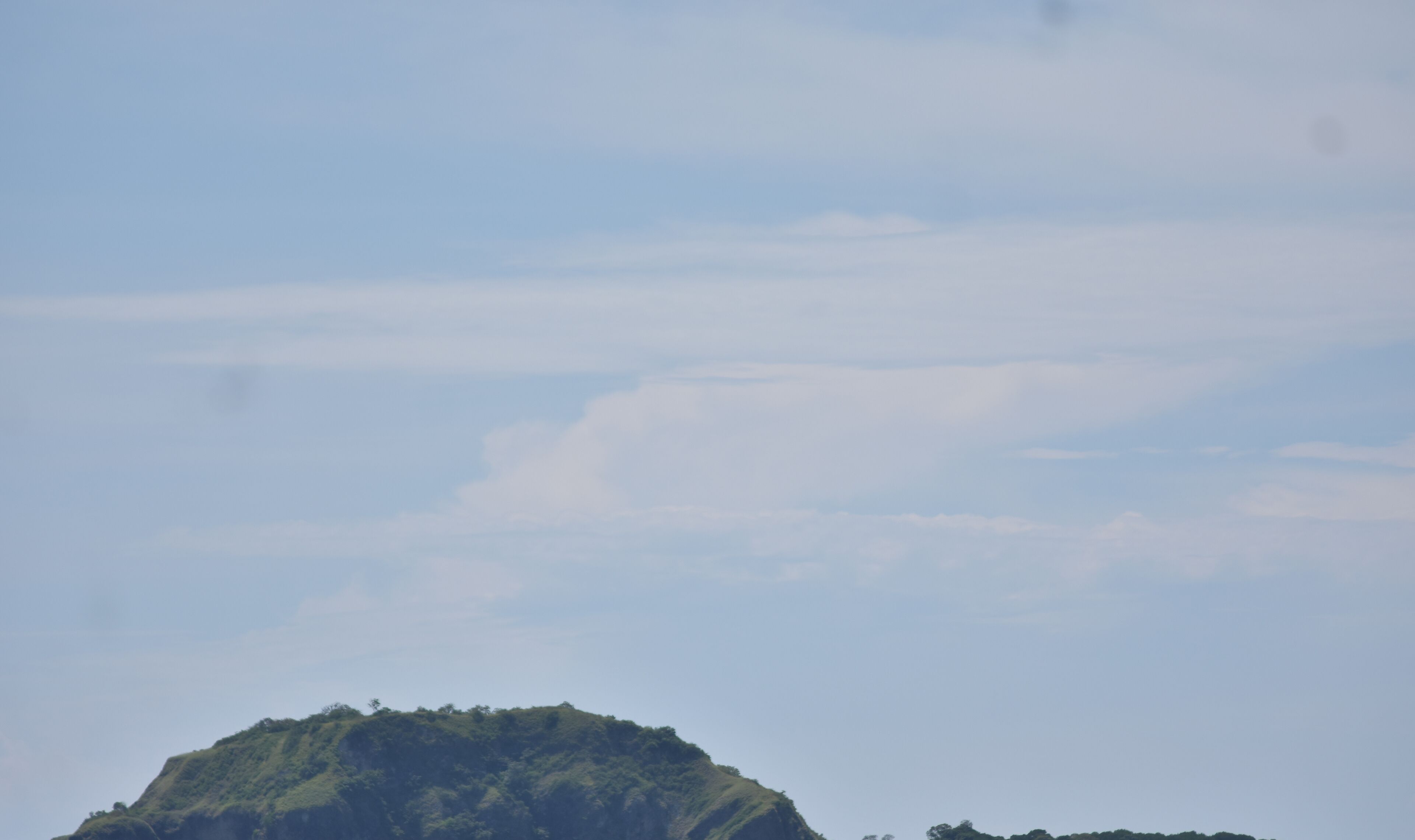 A mountainous landscape with a clear sky.