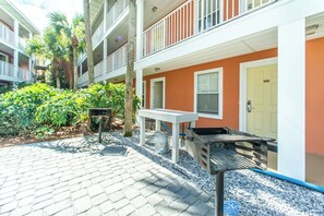 Relax in our covered outdoor seating area with a table and benches.