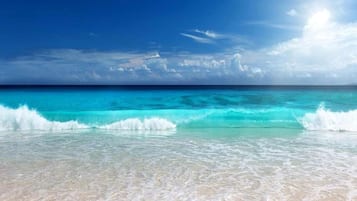 On the beach, sun-loungers, beach towels