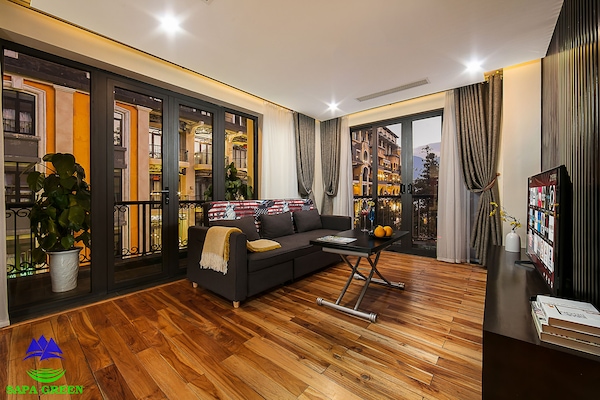 Luxury Suite | Living room | 32-inch TV with cable channels