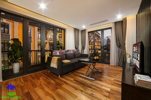 Luxury Suite | Living room | 32-inch TV with cable channels