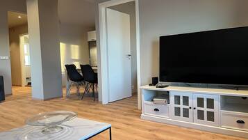 Apartment, 2 Bedrooms | Living area | 20-inch TV with cable channels