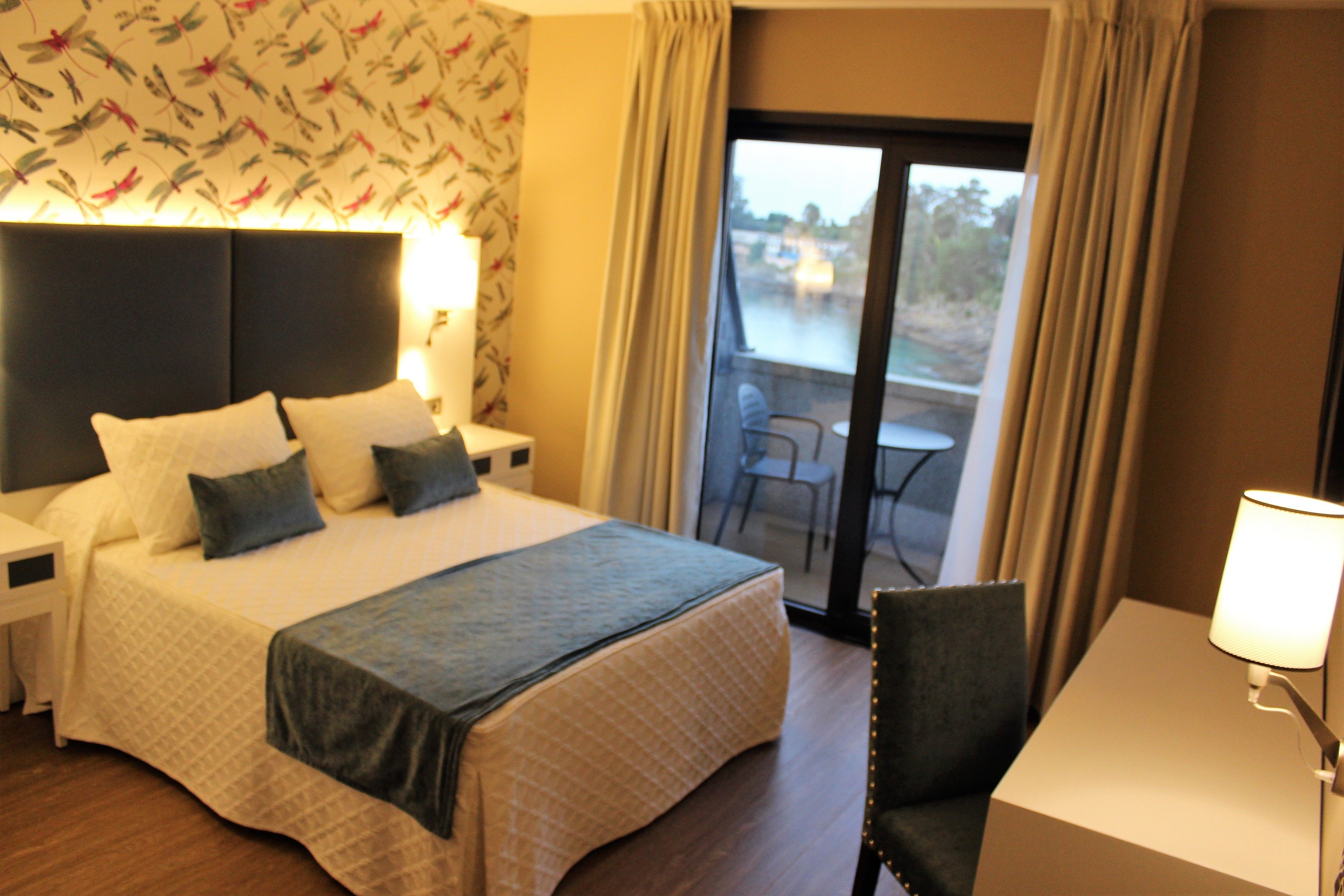 Habitación doble, vistas al mar | Ropa de cama de alta calidad, escritorio, cortinas opacas