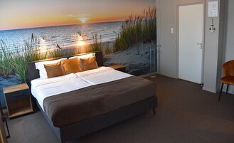 Habitación Confort doble | Ropa de cama de alta calidad, minibar, caja fuerte y escritorio