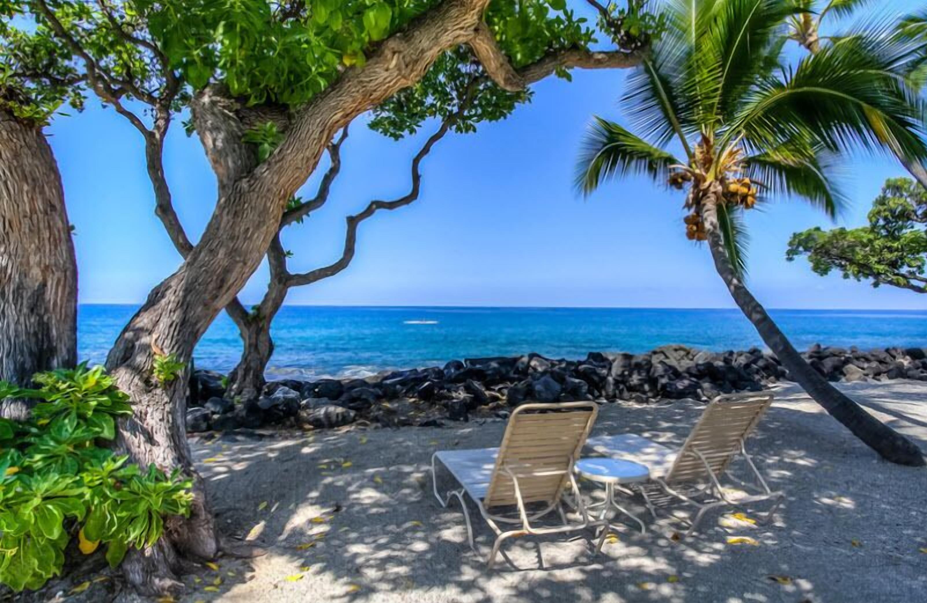 On the beach, sun loungers, beach towels