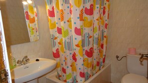 Bathtub, hair dryer, towels