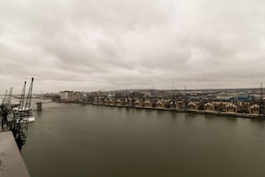 A waterfront view with buildings along the riverbank.