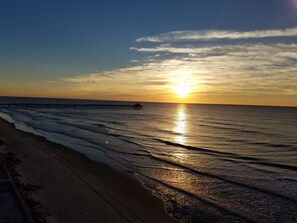 Enjoy a serene beach experience with gentle waves lapping at the shore.