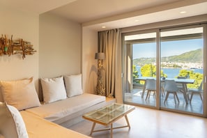 Suite, 2 Bedrooms, Sea View | Living area | Flat-screen TV, printers